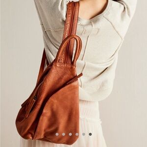 Free people we the free soho convertible sling in distressed brown. 100% leather